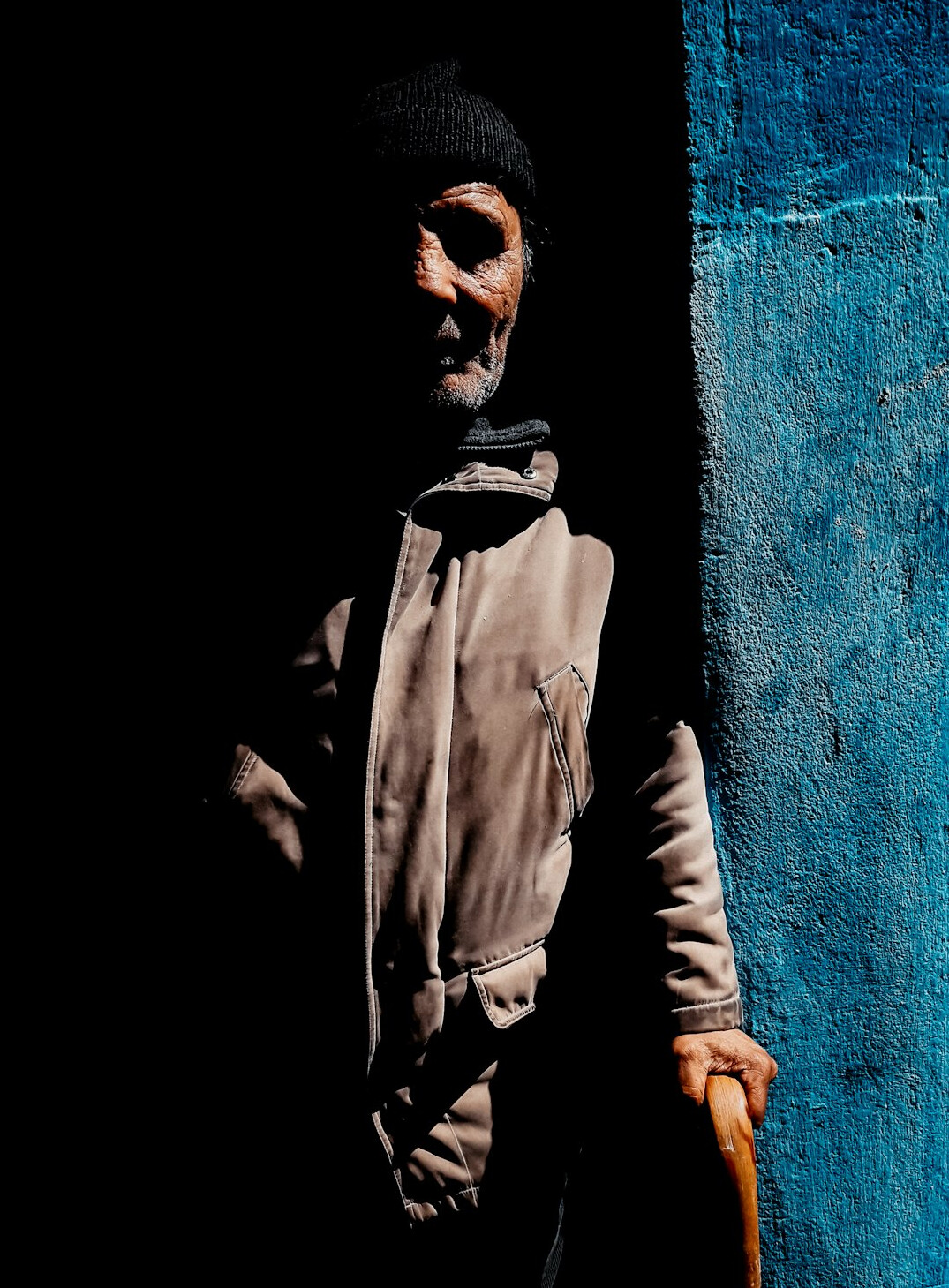 Portrait of a bearded man in a dark jacket